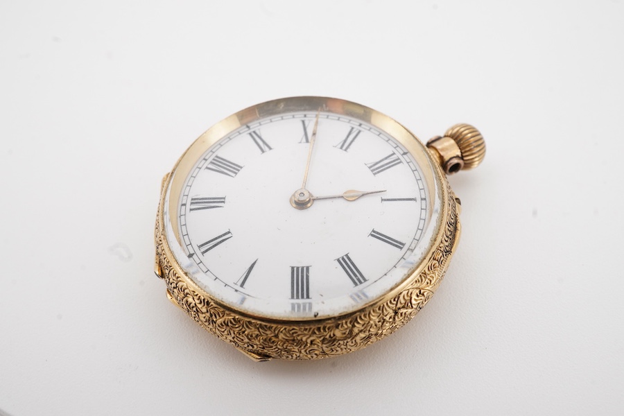 A lady's early 20th century engraved 18k lady's keyless open faced fob watch, with Roman dial, case diameter 32mm, gross weight 26 grams.
